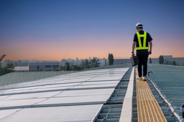 Inspector examination of photovoltaic modules using a thermal im Inspector examination of photovoltaic modules using a thermal imaging camera. Engineer Checking Temperature the string cables input to inverter solar panel used thermos infrared.